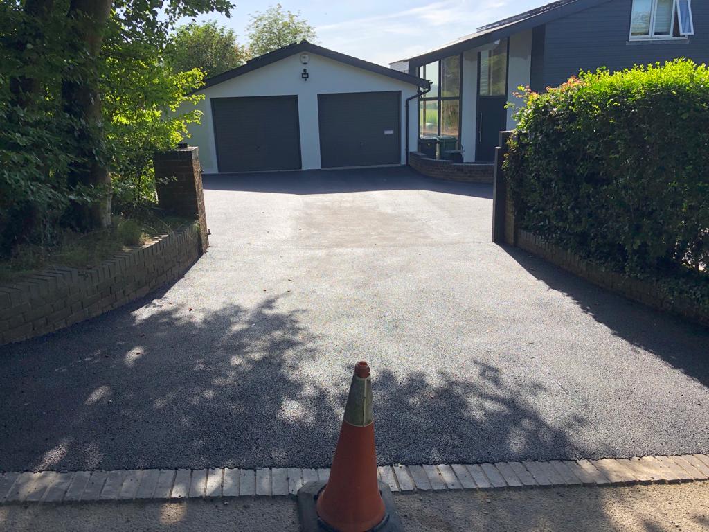 This is a photo of a bitumen driveway which is in the process of being installed by Dandenong South Road Tech